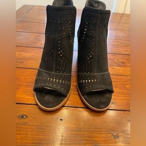 Fergalicious detail black booties.